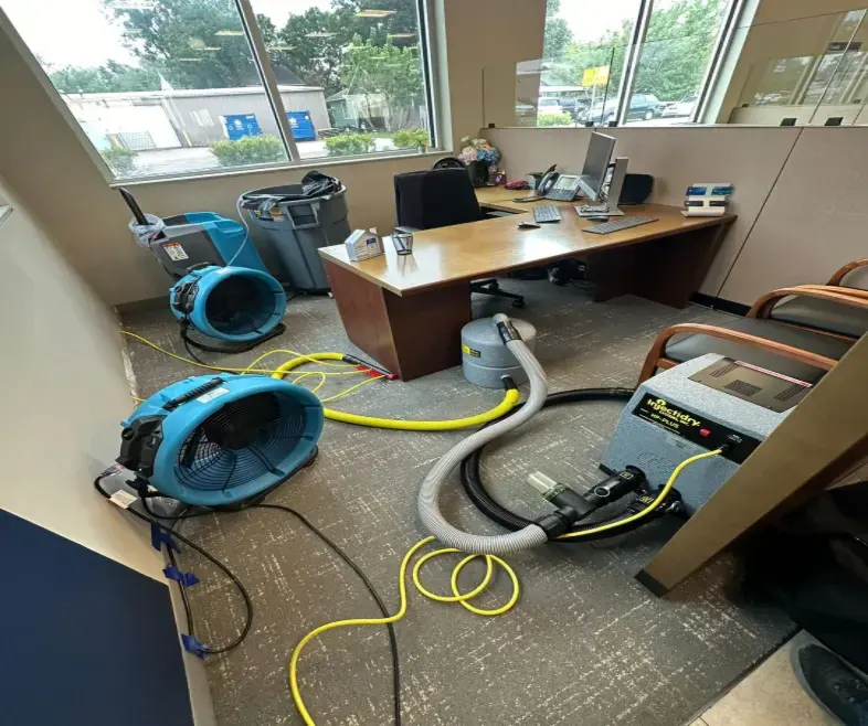 Air movers and extraction equipment drying a Framingham commercial office