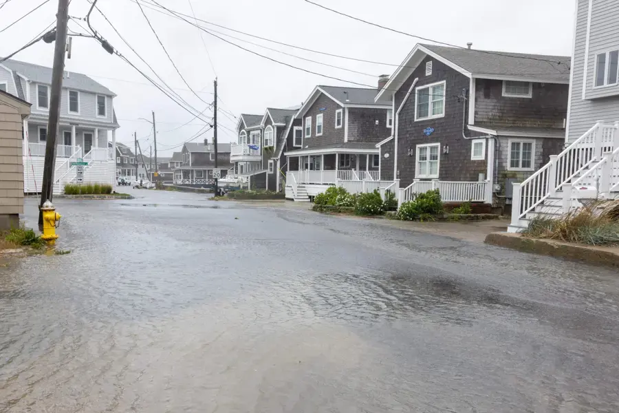 Storm water flooding a residential street after a nor'easter in Massachusetts
