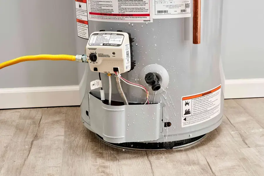 Water leaking from the base of a tank water heater